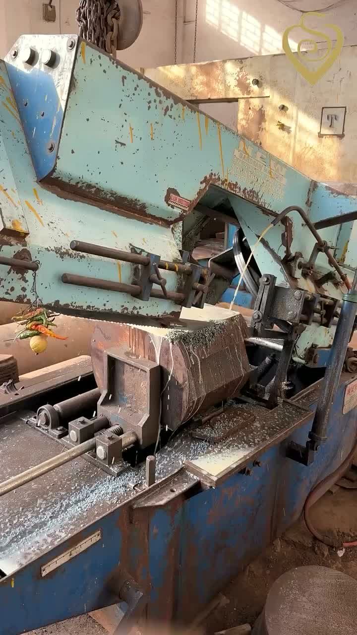 Band saw cutting a heavy forged round at Siddhivinayak Steels