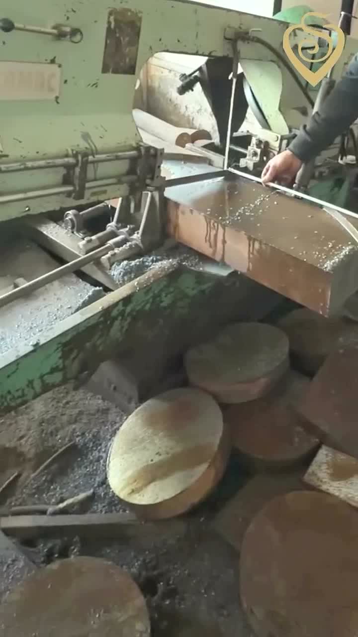Band-saw-cut steel discs and block at Siddhivinayak Steels